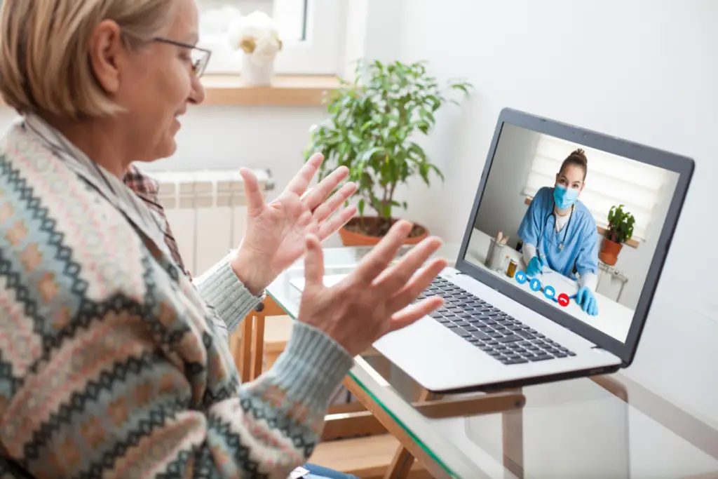 Patient talking to doctor on laptop